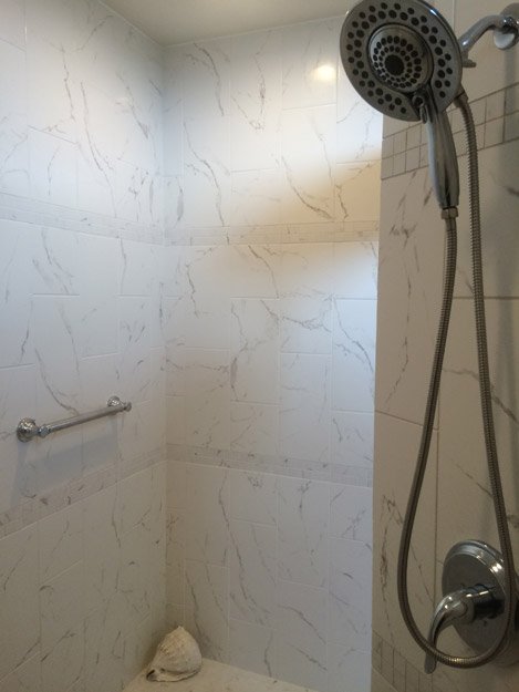 tile installation in bathroom - Contract Interiors, IN